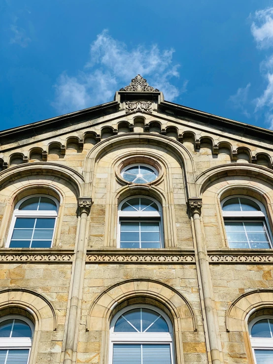 a building with multiple windows under the blue sky