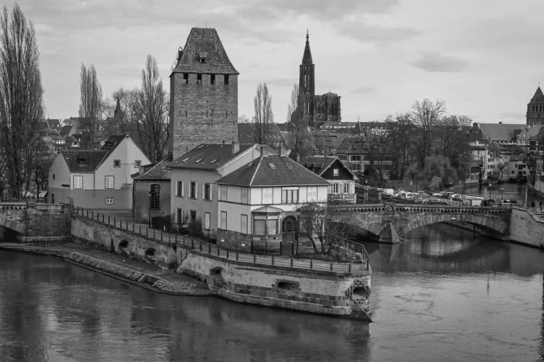 a river with buildings along the side of it in a city