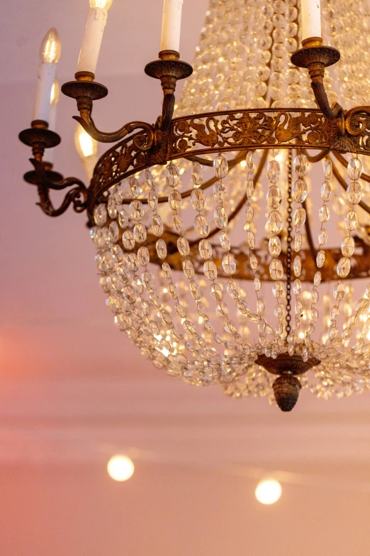 a chandelier hanging from a ceiling with two lights