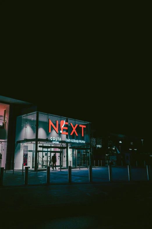 an image of a lit up store front at night