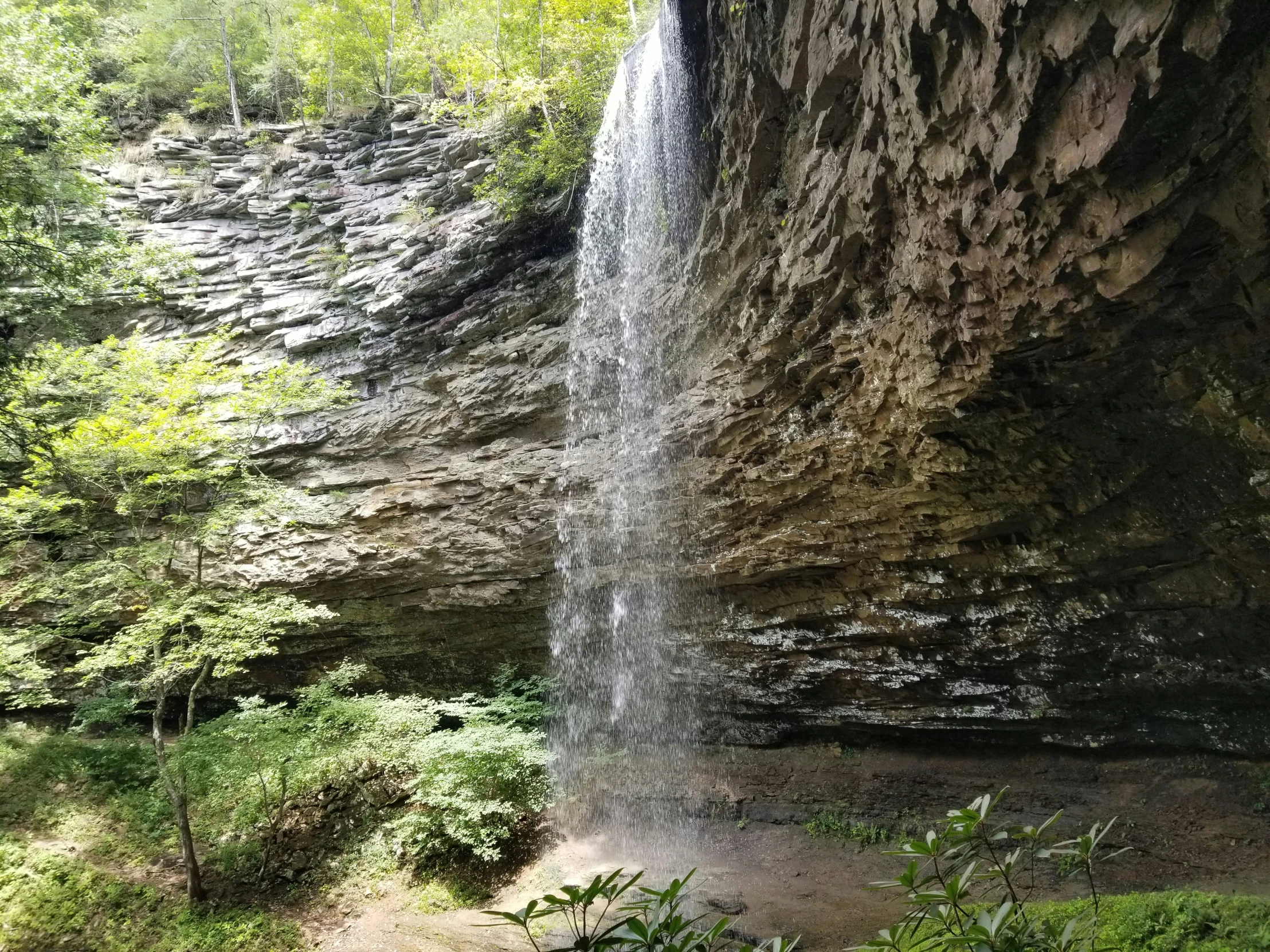 a waterfall cascading in between two huge rocks