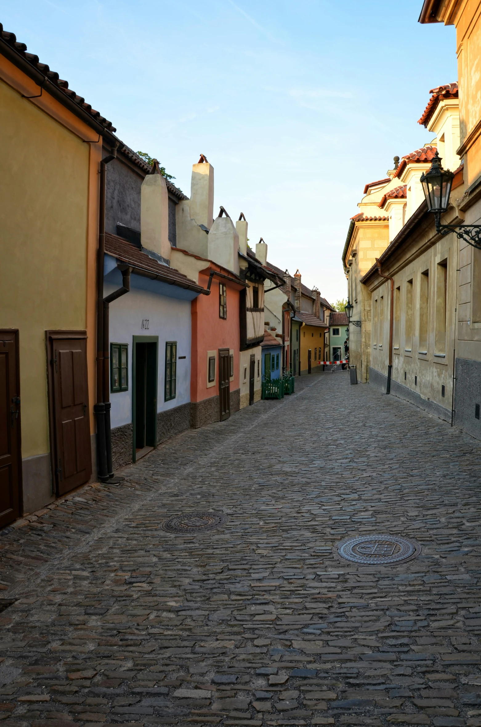 an old street with cobblestone roads and old buildings