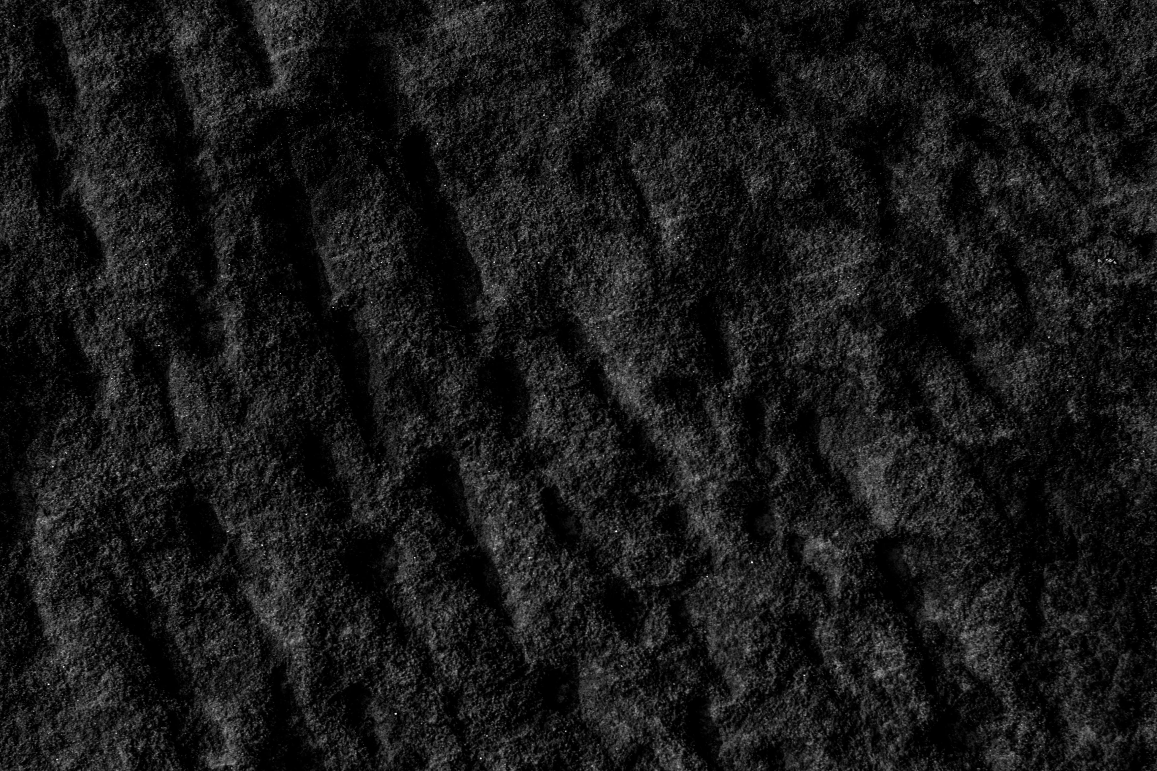 a black po of rough lines on a plain