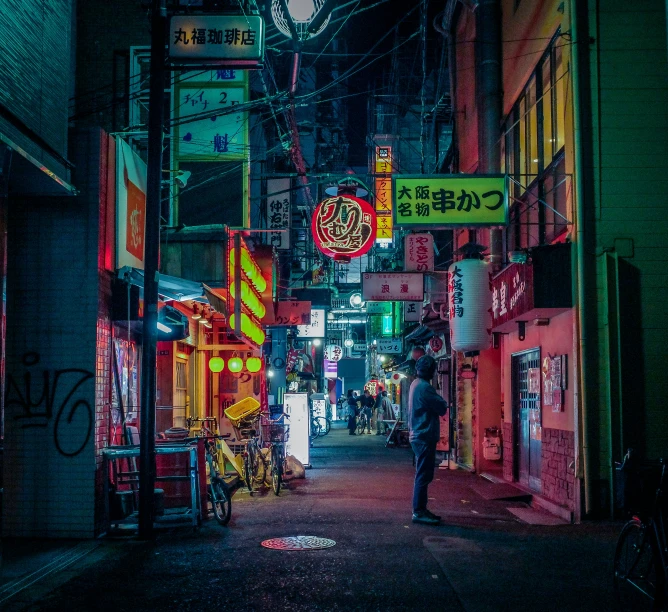 a person standing at the end of an alley way