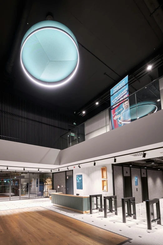 a view of an empty indoor venue with a circular light fixture