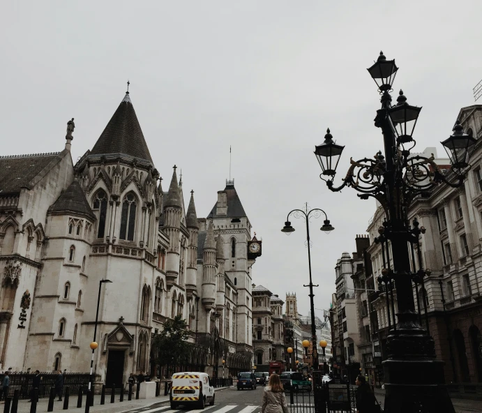 two stone buildings a street and traffic light