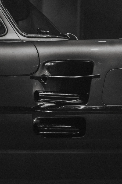 an old model car with chrome trim parked