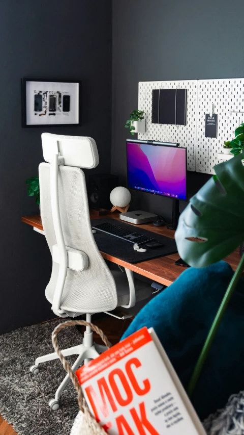 a modern desk and computer in an office