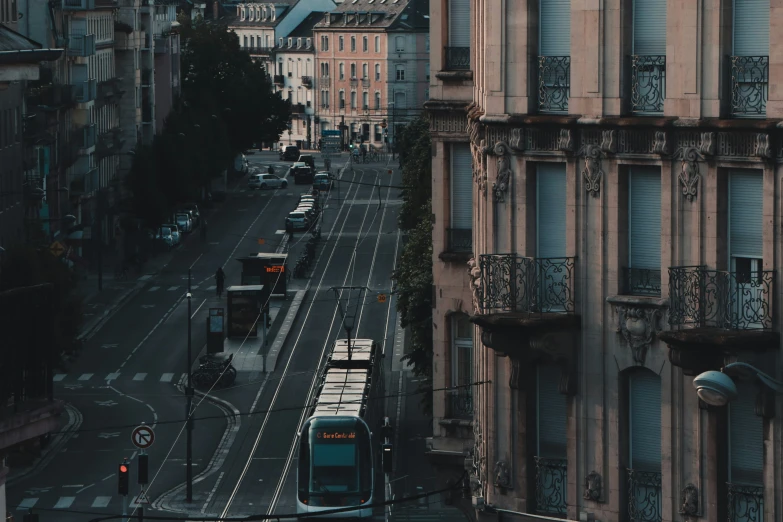 view from an upper level over street with trams and streetcars