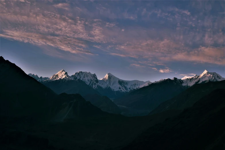 a mountain landscape with mountains in the background