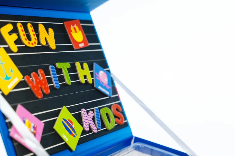 magnets on a blackboard with the word fun is written across the board