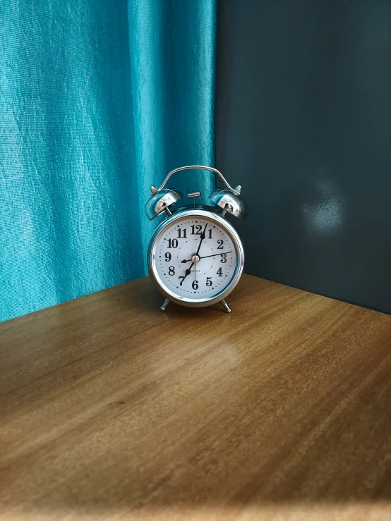 an alarm clock sitting on top of a table