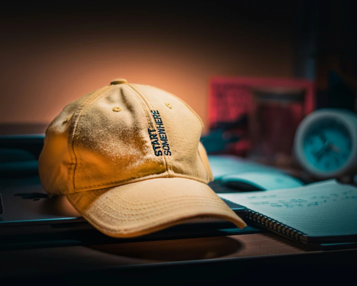 an old yellow hat sitting on a table