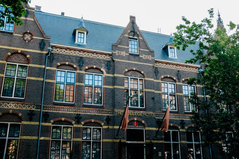 an old building has many windows and a steeple