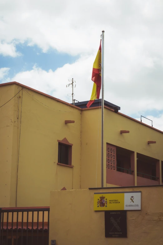 a flag flying from the roof of a building