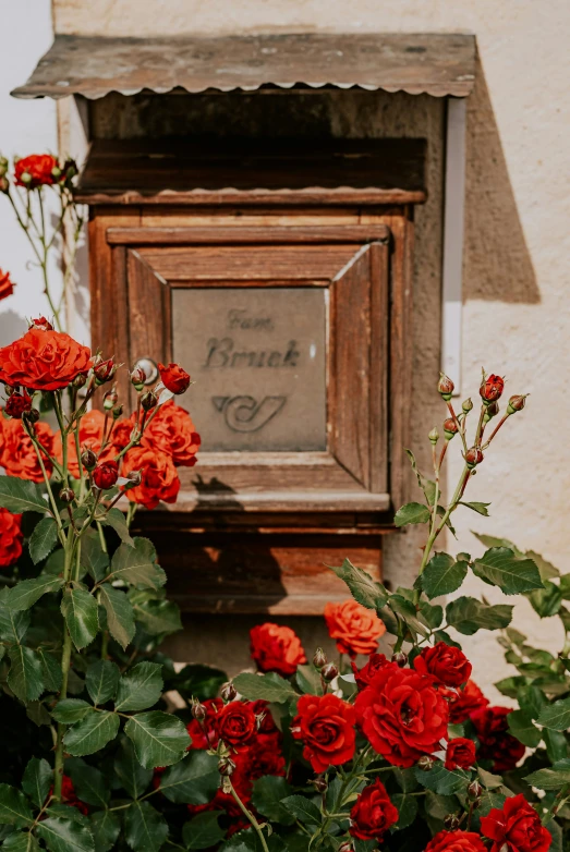 an old wooden frame has been adorned with flowers