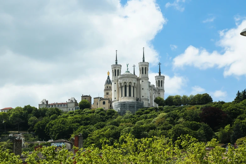 a large building sitting on top of a hillside