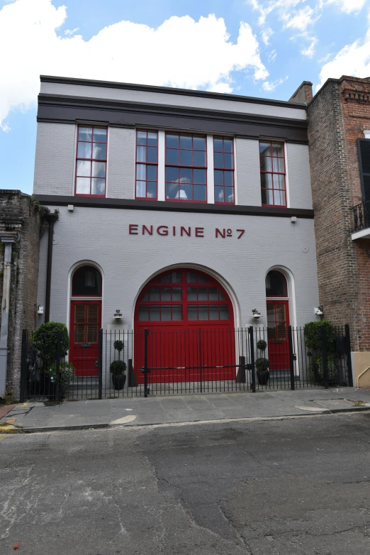 the entrance to a business that is next to another building