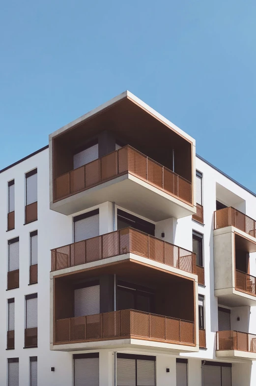 an apartment building with multiple balconies on the balconies