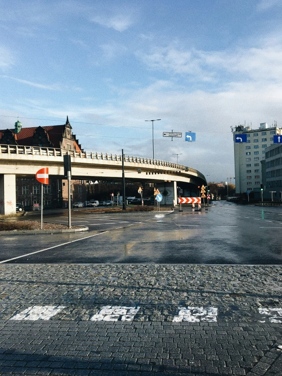 a large road with the streetlights on either side of it