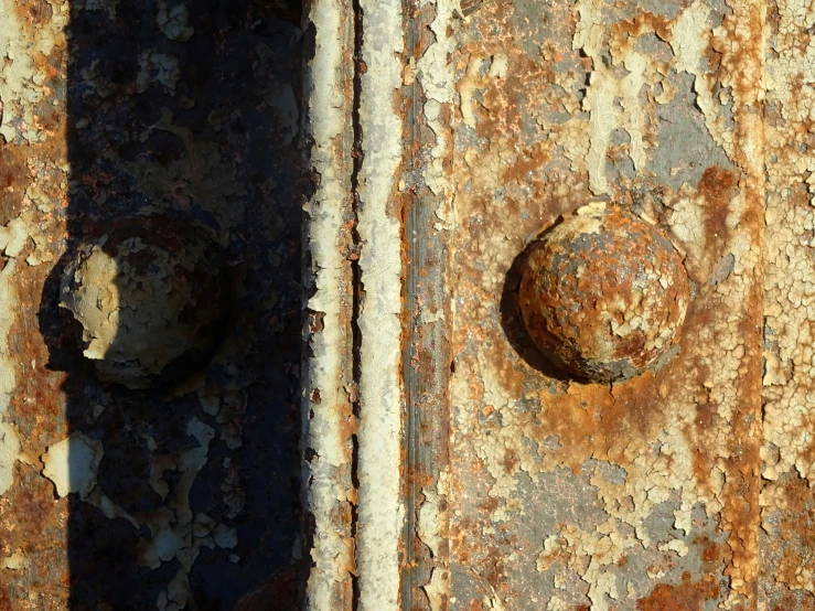 rusted metal and white paint is displayed in this artistic po