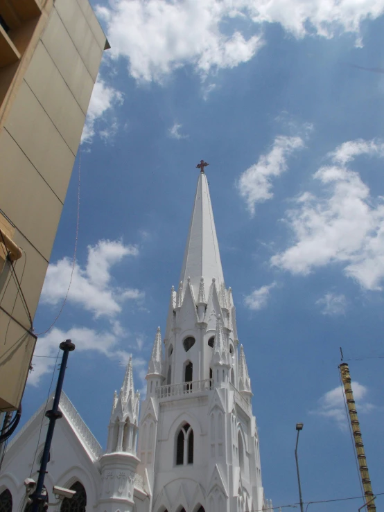 a large church building with tall spires on a sunny day