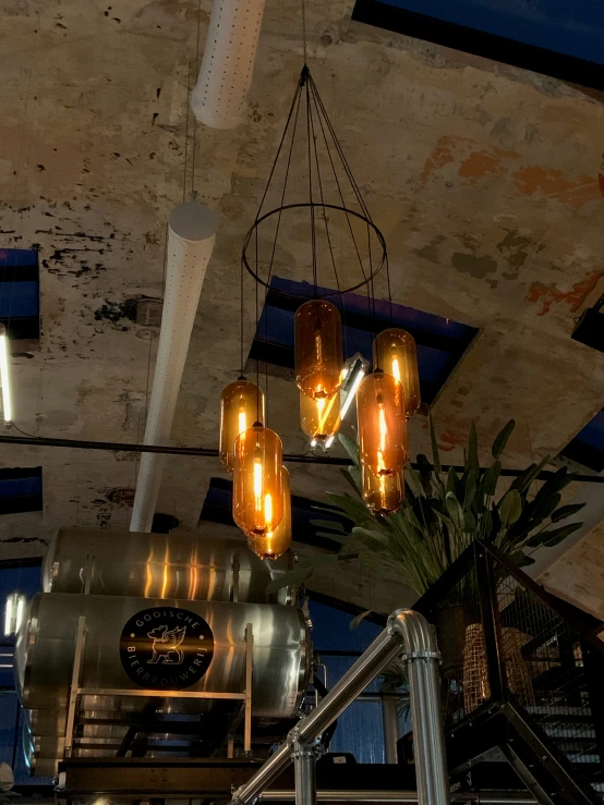 industrial lighting is on the ceiling in an abandoned building