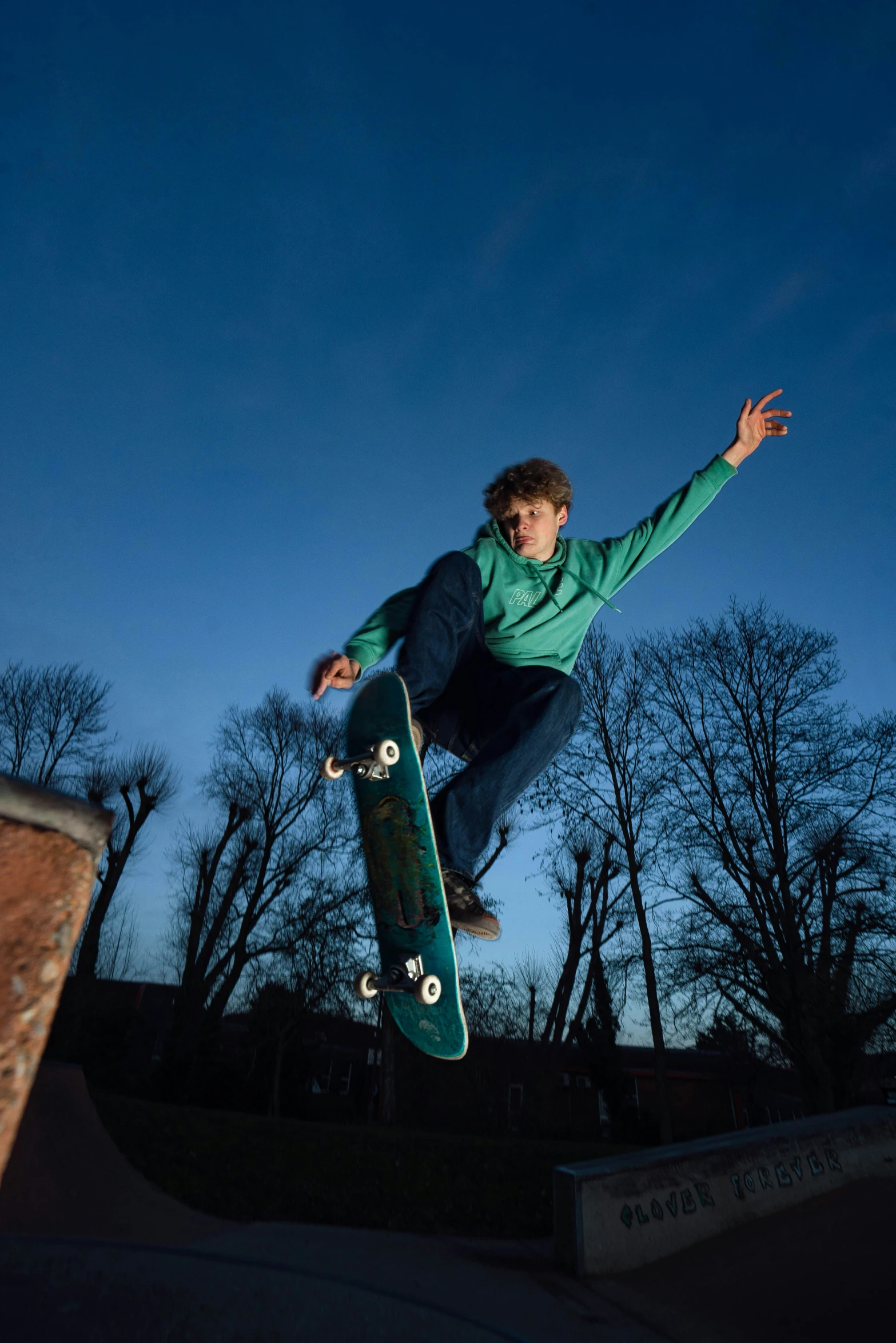 a skateboarder flying through the air on his skate board