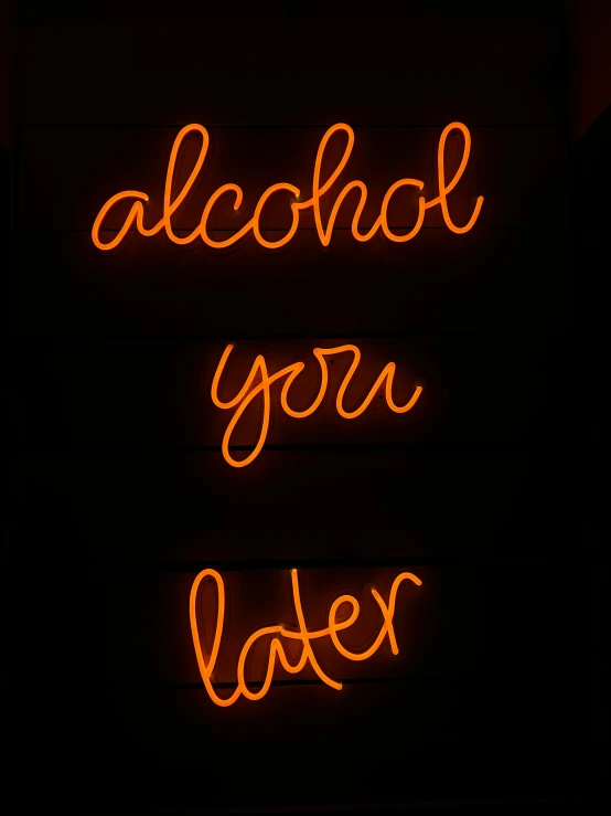 a neon sign reading, alcohol your latex