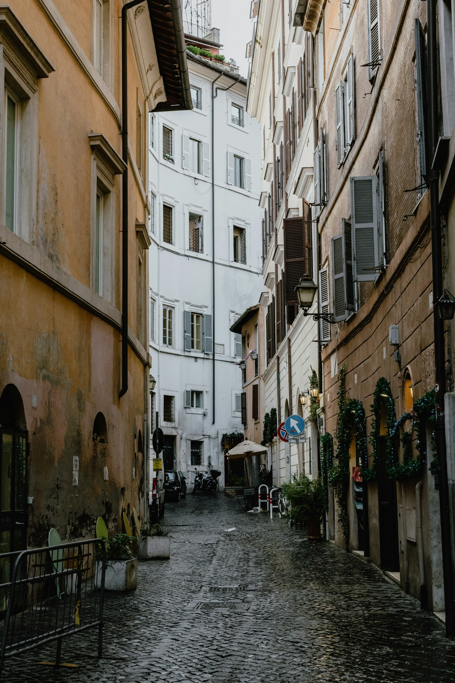 some buildings and a cobblestone street in a city