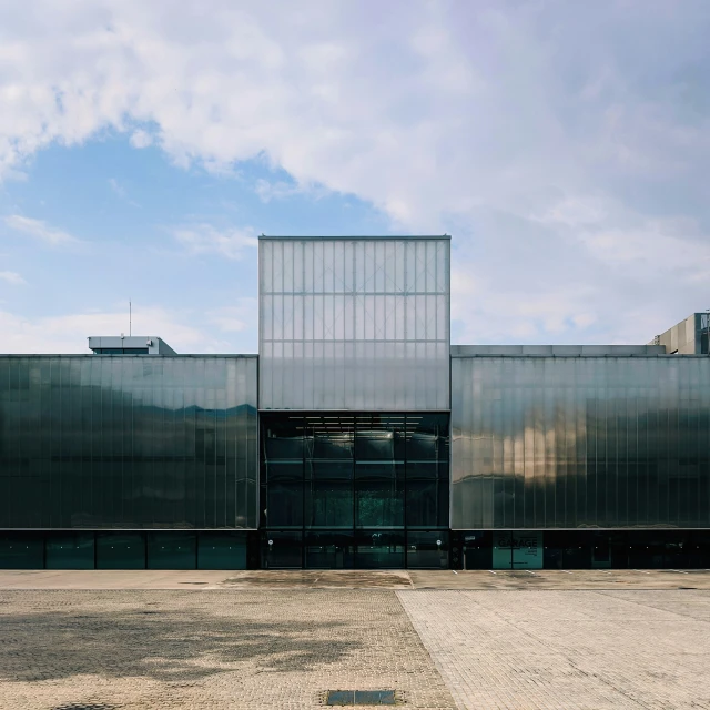 a black building with two towers on a sunny day