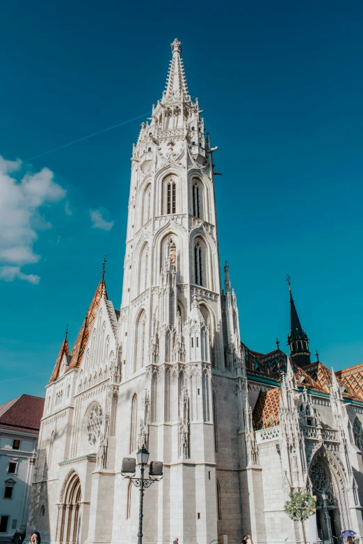 the old cathedral has many spires as well as large clock tower