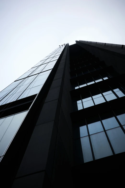 looking up at the sky through the windows of a building