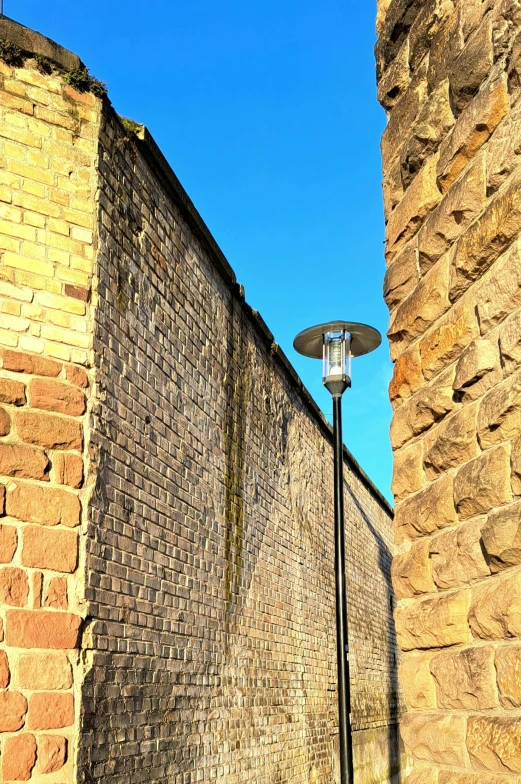 a light is on on an old brick wall