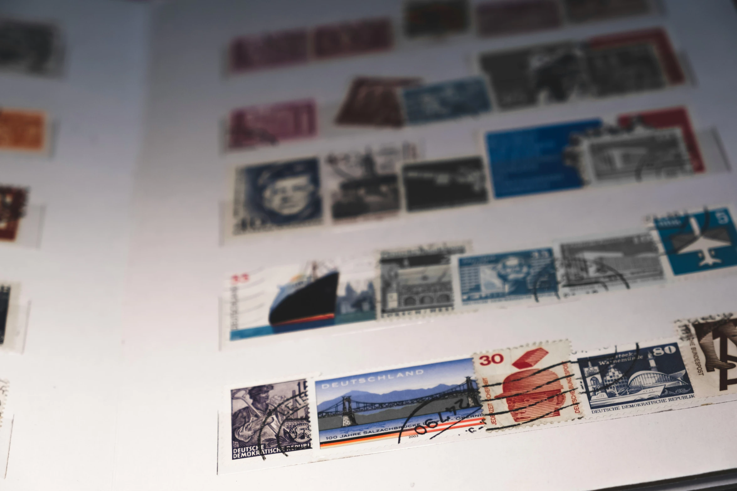 various stamps and postmarks on display inside of a box