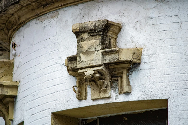 a sculpture above a doorway to a building