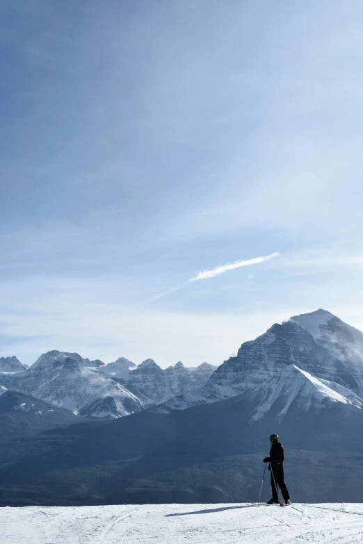 a man skiing across a snow covered mountain