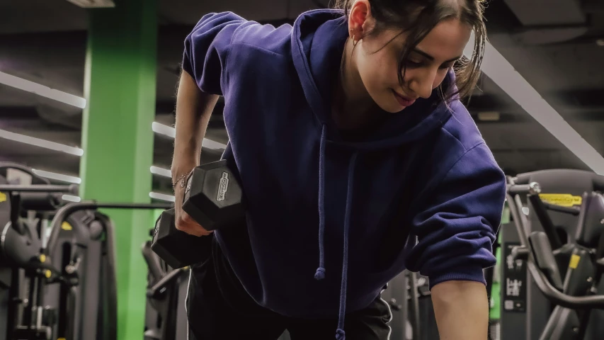 a woman looking at her watch while exercising