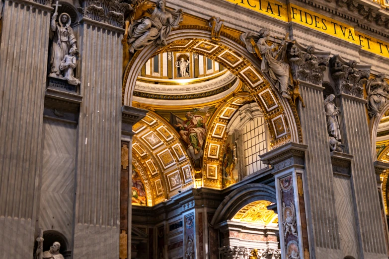 a very ornate archway with fancy decor is lit up