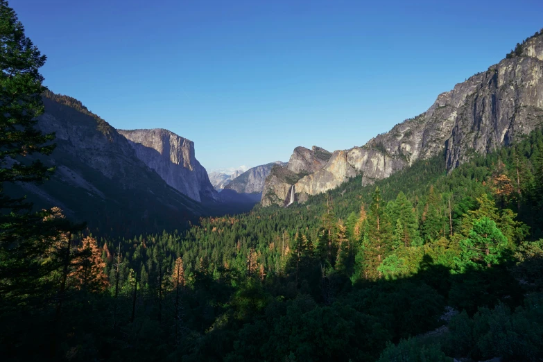 many tall mountains with very little trees on them