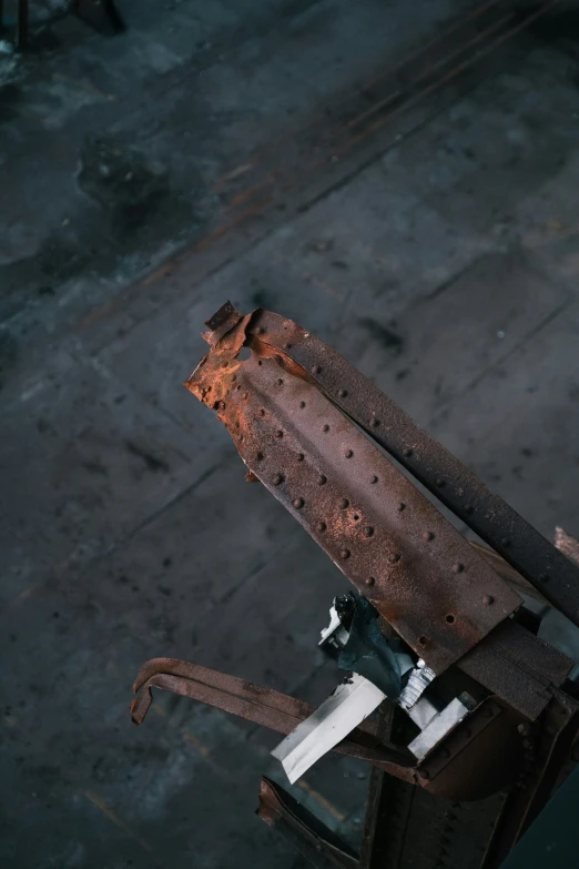 a rusty tool is lying against the surface