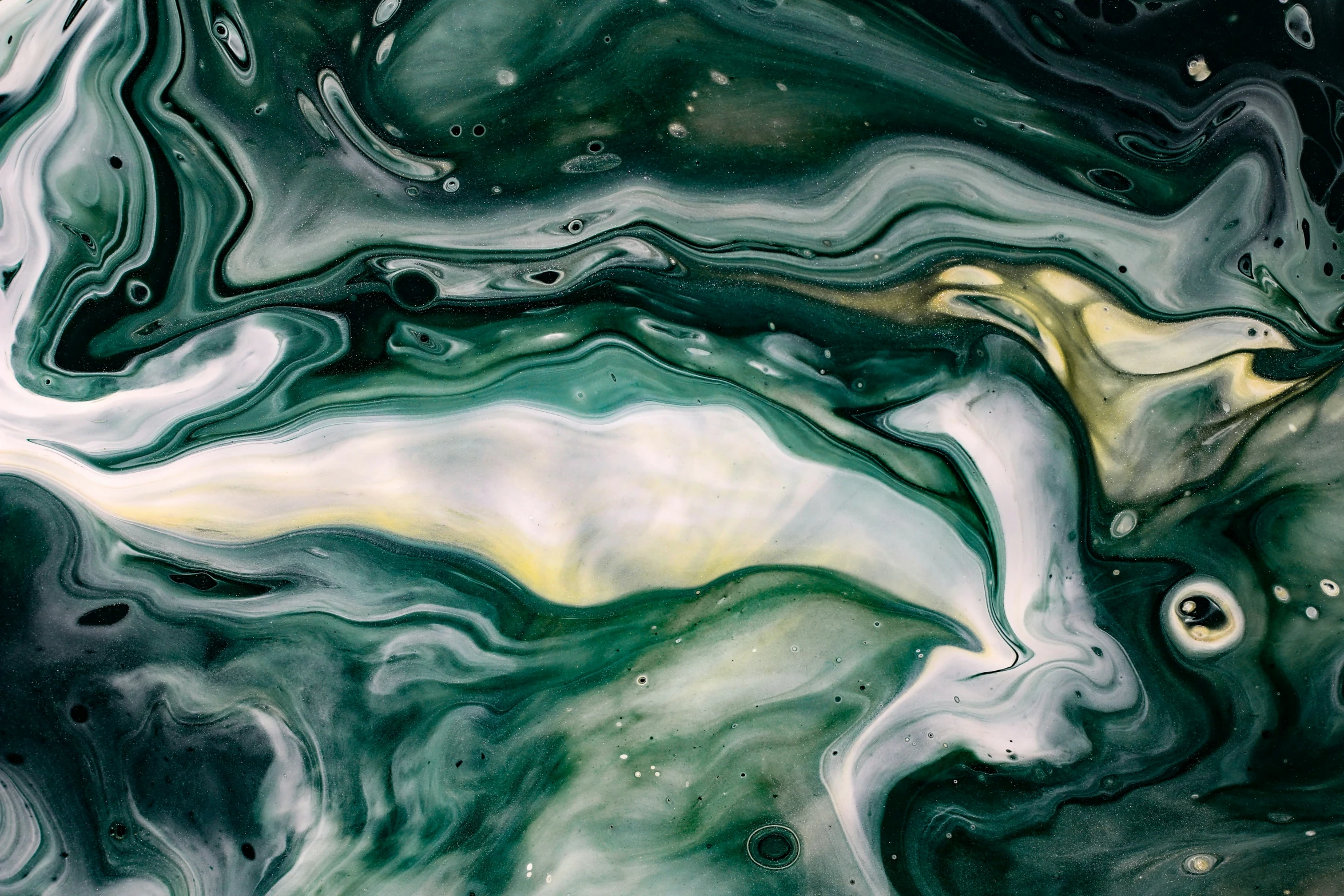 an abstract fluid painting with gold accents and green swirls