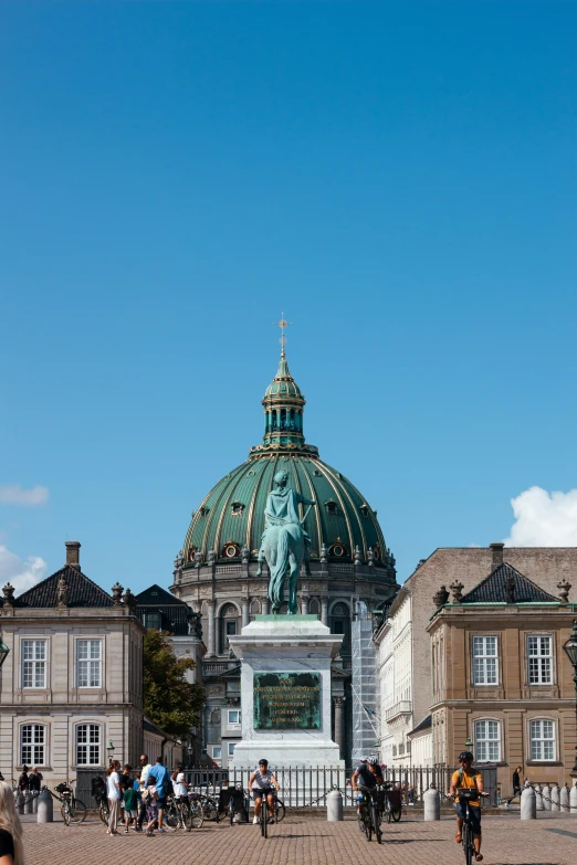 a small white statue with a large dome over it