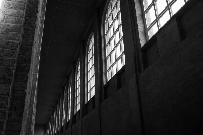 two long windows in a large black and white building