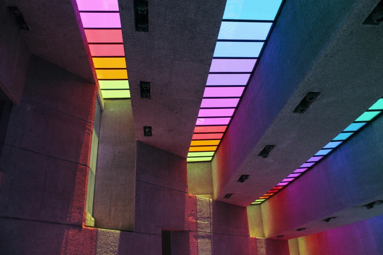 a hallway filled with lots of neon lights