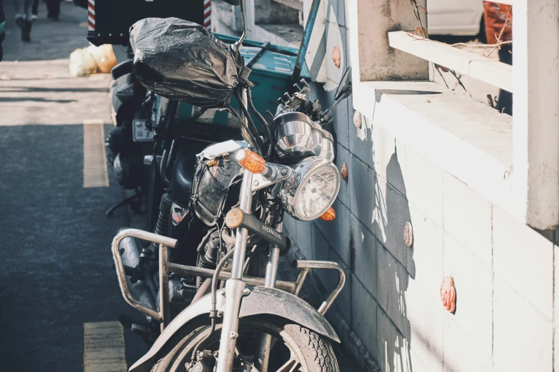 a motorcycle parked on the side of a building