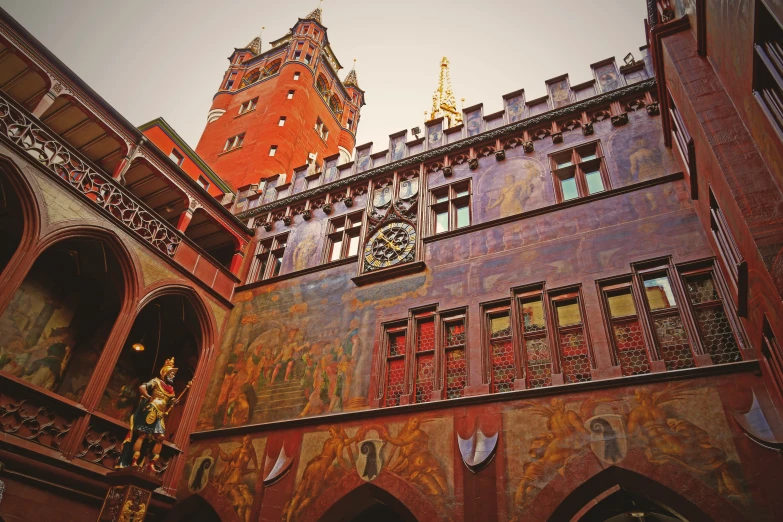 an ornate building with intricate paintings painted on the outside wall