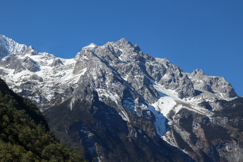 a very big mountain range covered in snow