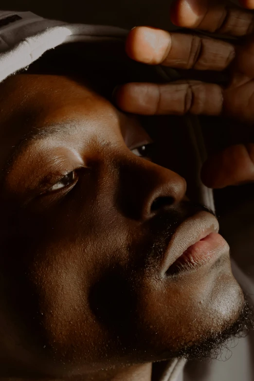 a close up of a person brushing their hair