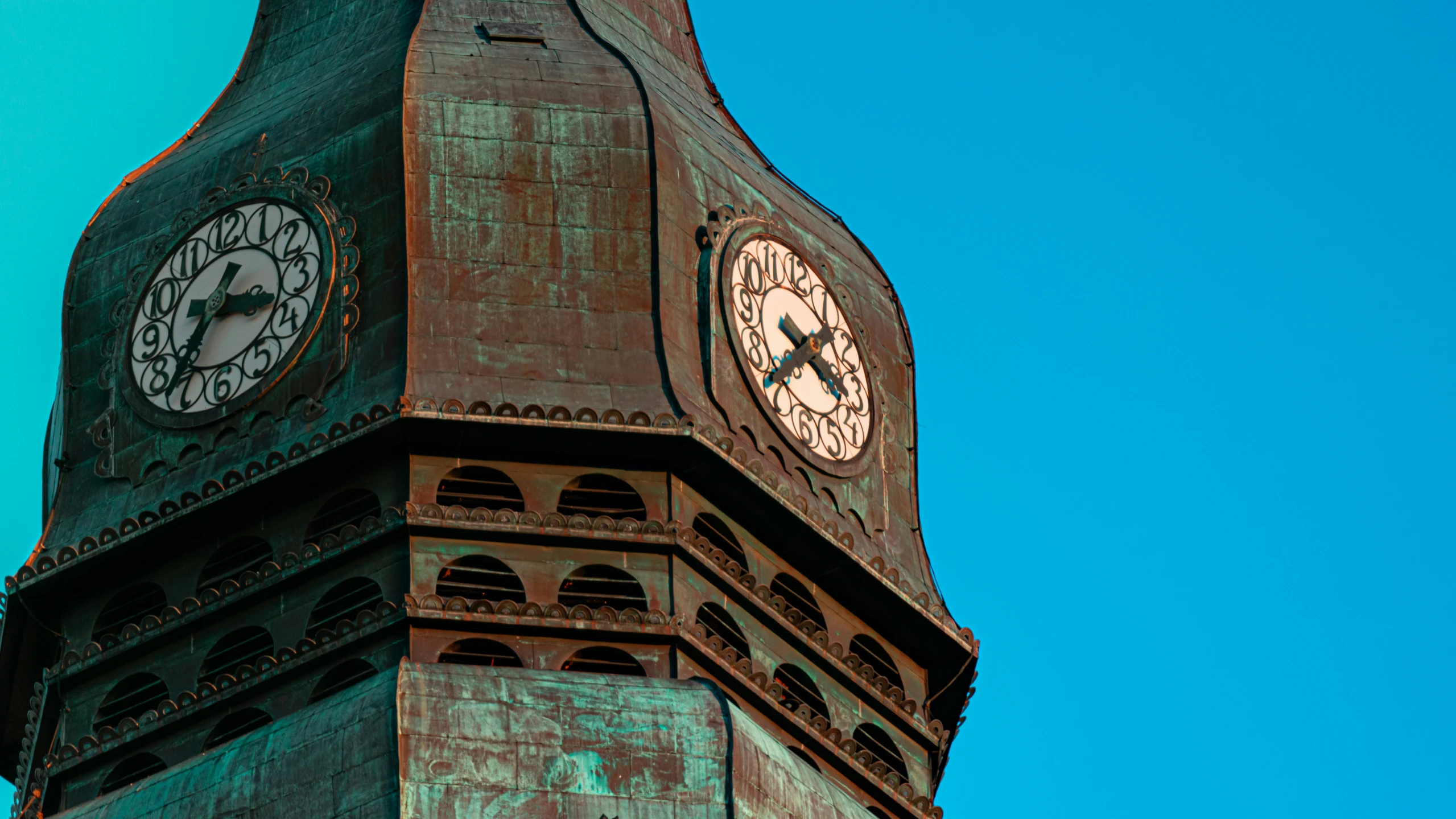 this is an old clock tower with a clear blue sky